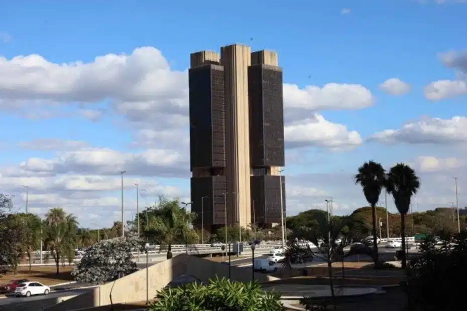 Edifício do Banco Central do Brasil com elementos gráficos digitais integrados, simbolizando a nova regulamentação de criptomoedas.