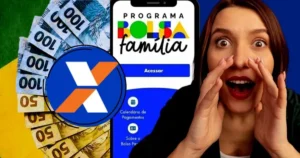 Mãos segurando um celular com o aplicativo Caixa Tem aberto, mostrando o pagamento do Bolsa Família
