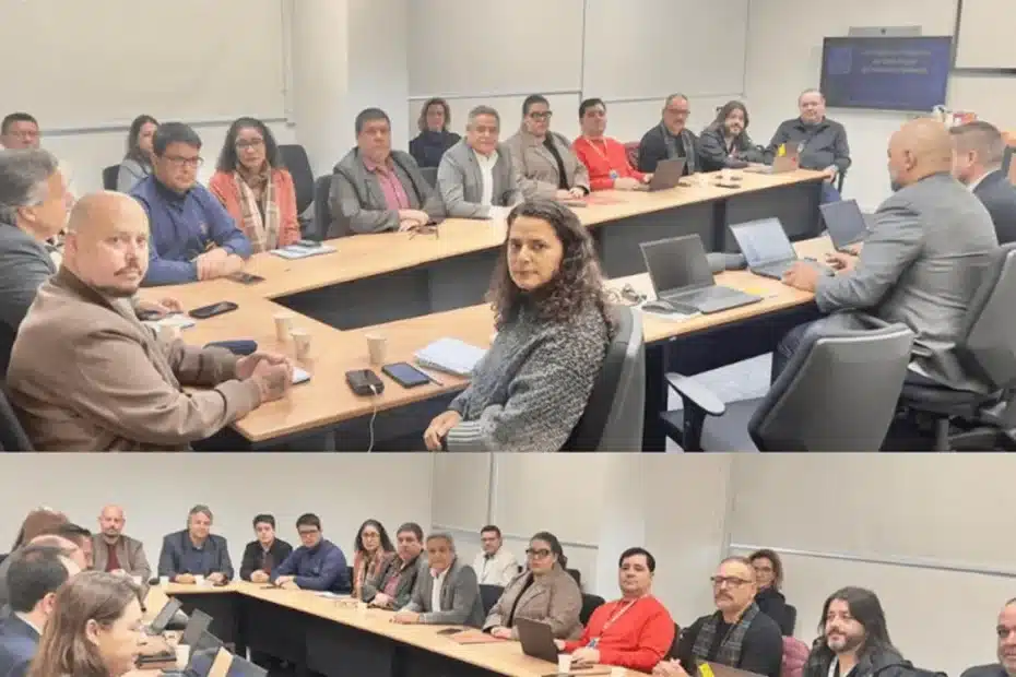 Pessoas em fila longa dentro de uma agência do Banco do Brasil, com funcionários visivelmente sobrecarregados, destacando a necessidade de concursos.